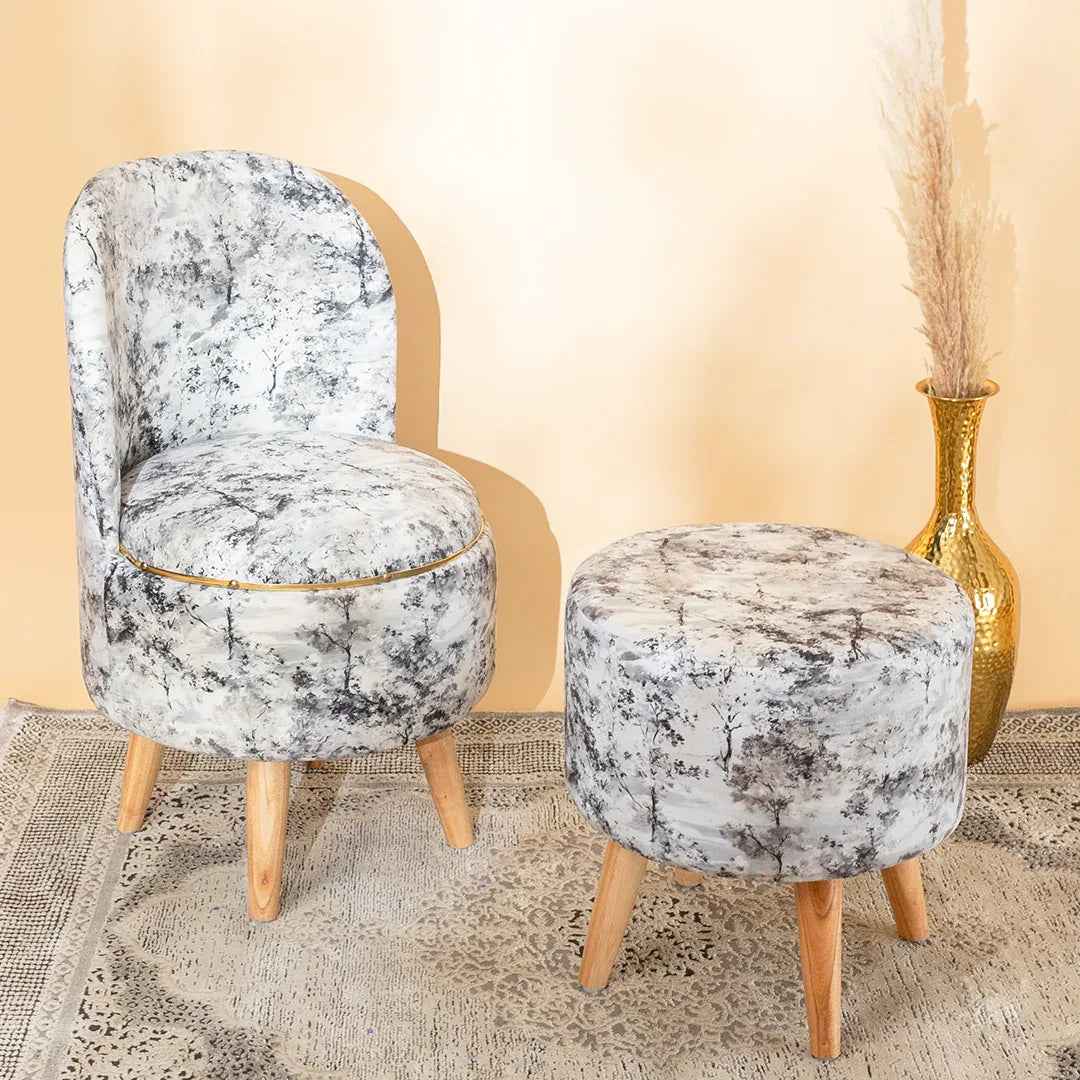 Decorative chair and ottoman with marble pattern on a beige background