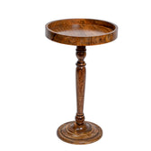 Wooden side table with a round top and tall cylindrical base on a white background